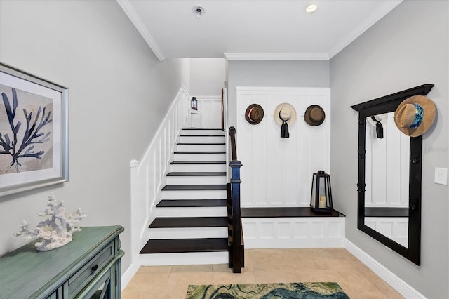 staircase featuring tile patterned floors and ornamental molding