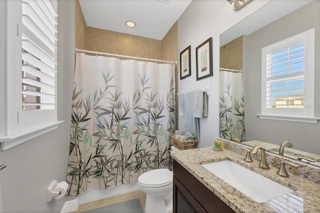 bathroom featuring tile patterned flooring, vanity, toilet, and a shower with shower curtain