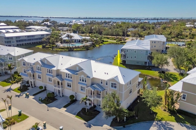 birds eye view of property featuring a water view