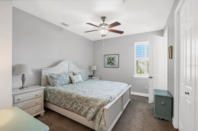 carpeted bedroom featuring a closet and ceiling fan