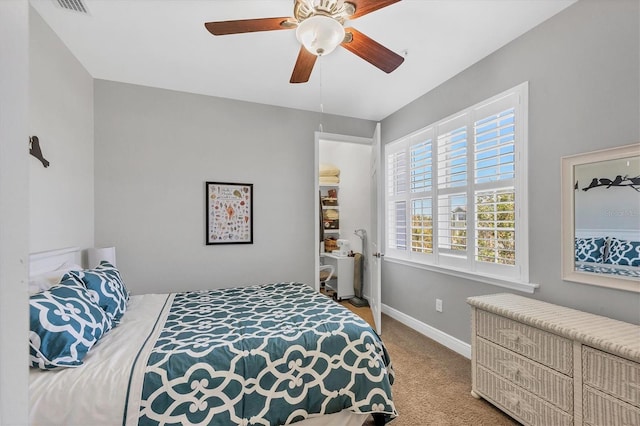 bedroom with ceiling fan and light colored carpet