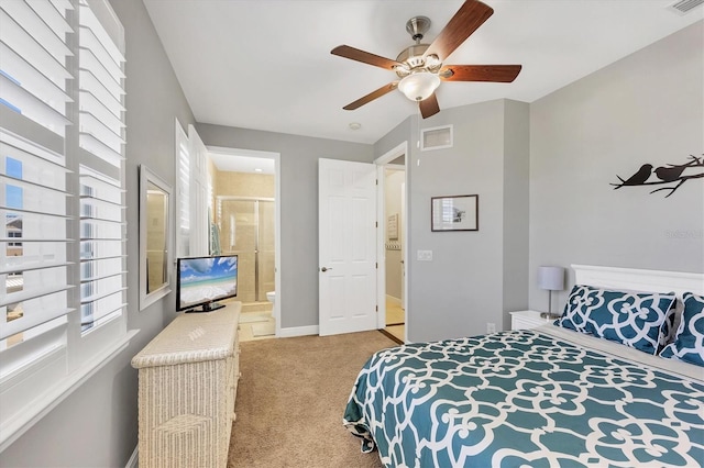 bedroom with light carpet, connected bathroom, ceiling fan, and lofted ceiling