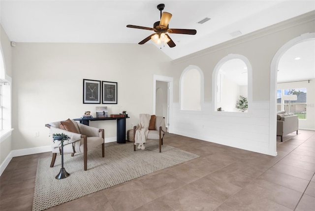 sitting room with ceiling fan, light tile patterned flooring, and lofted ceiling