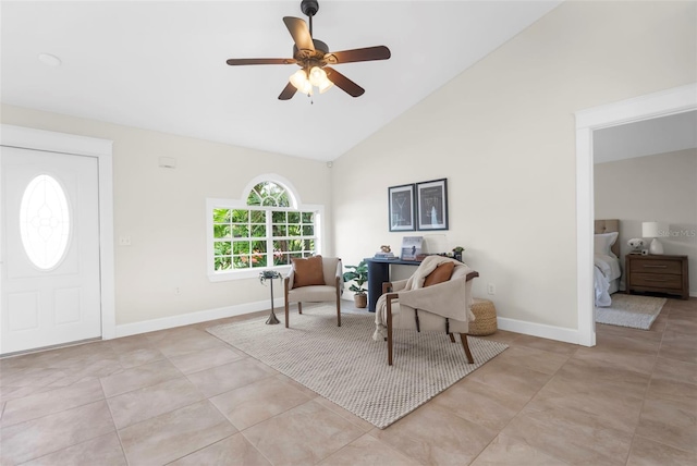 sitting room with ceiling fan, light tile patterned floors, and high vaulted ceiling