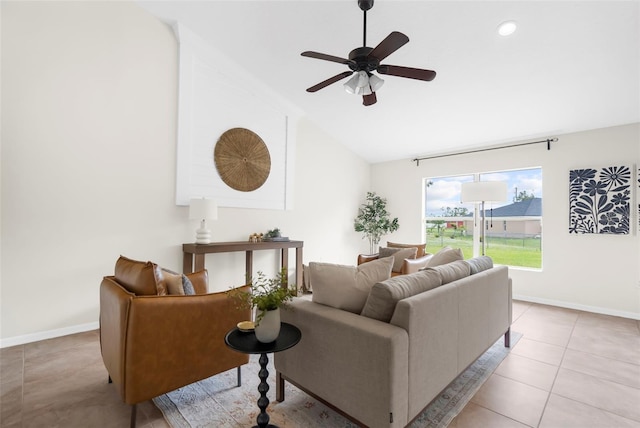 tiled living room with ceiling fan and lofted ceiling