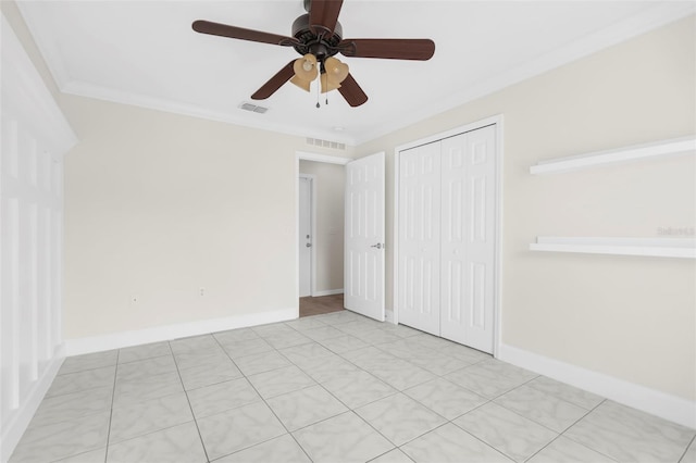 unfurnished bedroom featuring a closet, ceiling fan, and crown molding