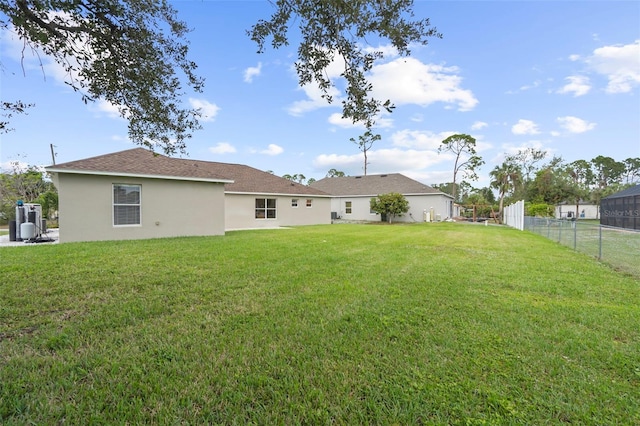 back of house with a yard