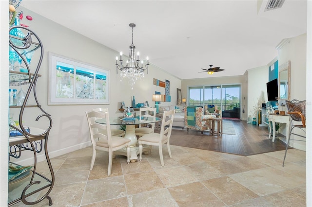 dining space featuring light hardwood / wood-style flooring and ceiling fan with notable chandelier