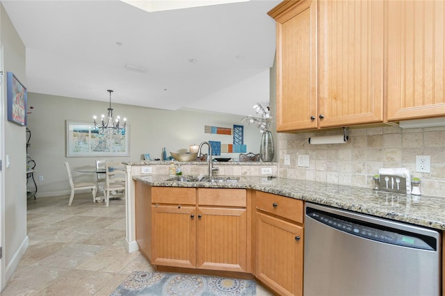 kitchen with kitchen peninsula, light stone counters, stainless steel dishwasher, and sink