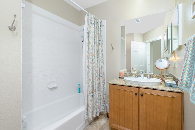 bathroom featuring tile patterned floors, shower / bath combination with curtain, and vanity