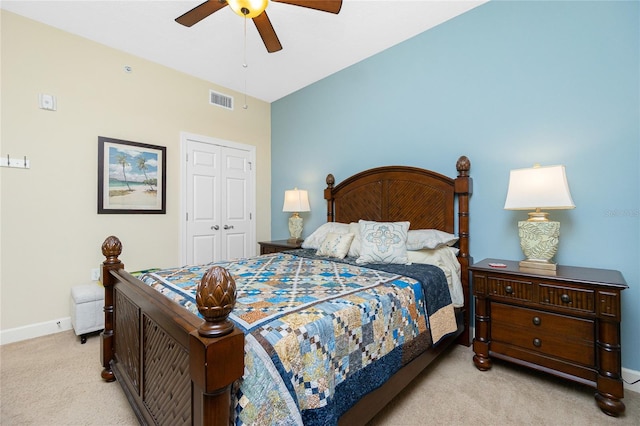 carpeted bedroom featuring ceiling fan, a closet, and lofted ceiling