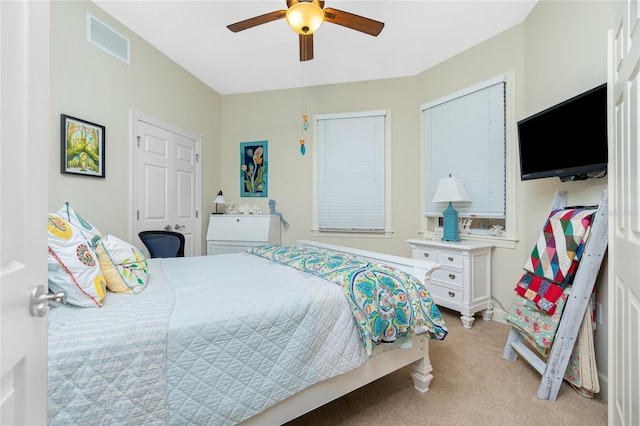 carpeted bedroom featuring ceiling fan