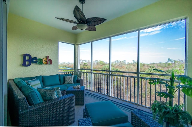 sunroom with ceiling fan and a healthy amount of sunlight