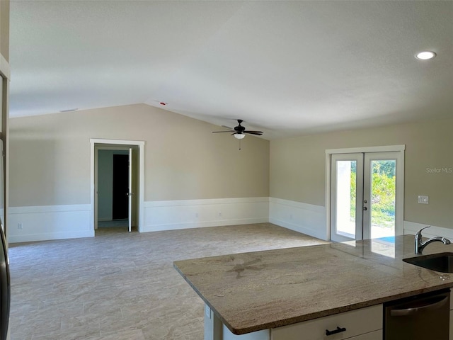 kitchen featuring dishwasher, vaulted ceiling, ceiling fan, white cabinets, and sink