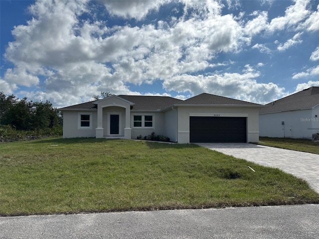 ranch-style home with a front yard and a garage