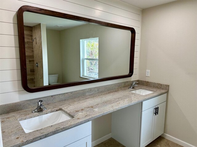 bathroom featuring toilet and vanity