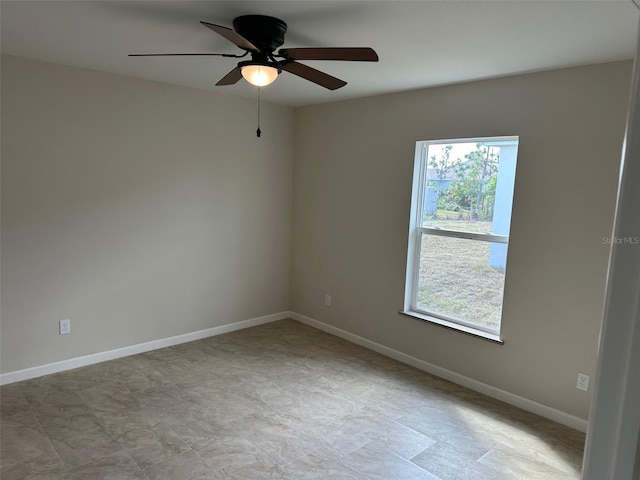 unfurnished room with ceiling fan