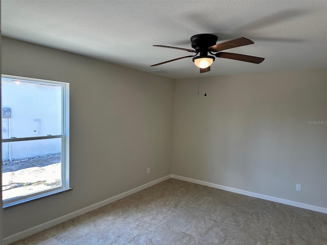 spare room featuring ceiling fan