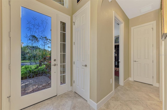 entryway with light tile patterned floors