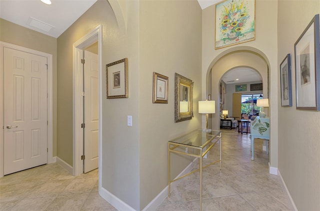 corridor featuring light tile patterned flooring