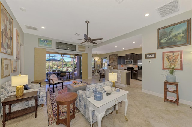 tiled living room featuring ceiling fan