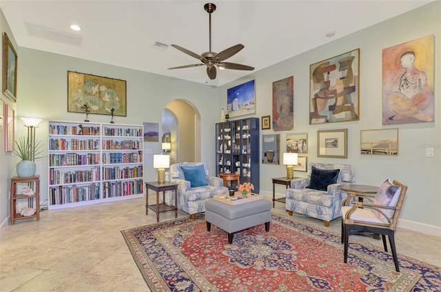 sitting room with ceiling fan and light tile patterned flooring