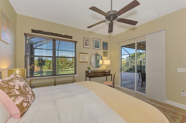 bedroom featuring access to exterior and ceiling fan