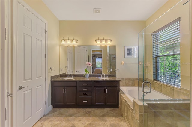 bathroom featuring tile patterned floors, separate shower and tub, and vanity