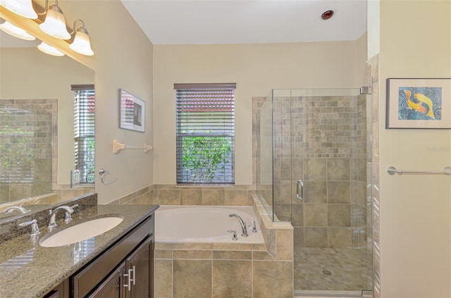 bathroom with vanity, separate shower and tub, plenty of natural light, and a notable chandelier