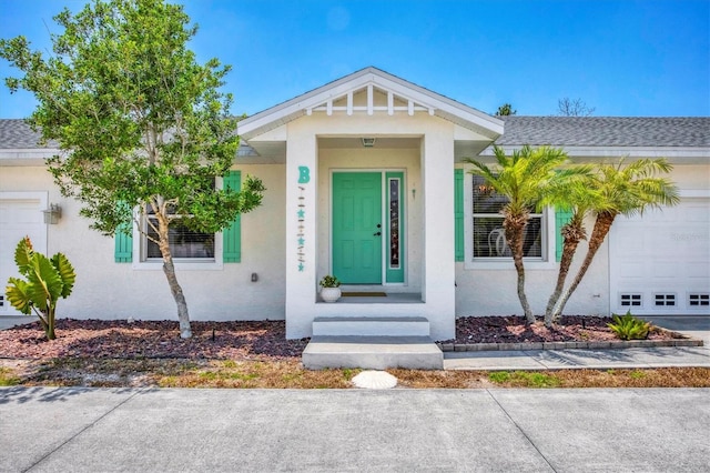 view of front of property with a garage