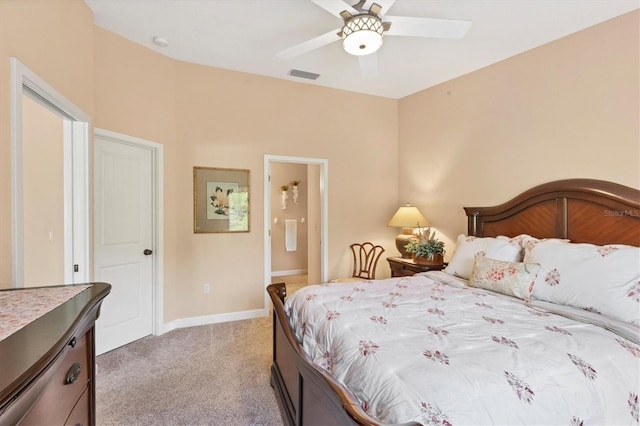 carpeted bedroom featuring ceiling fan and ensuite bathroom