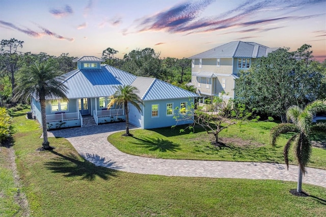 exterior space with a yard and covered porch