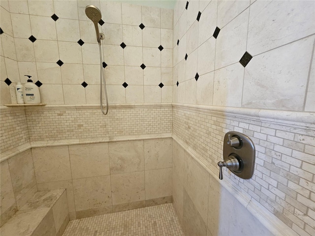 bathroom with a tile shower