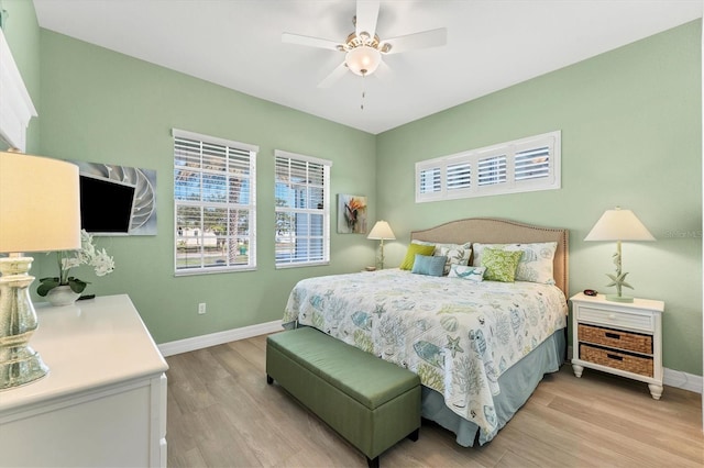 bedroom featuring light hardwood / wood-style flooring and ceiling fan