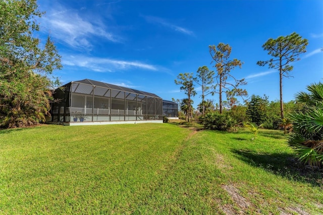 view of yard with glass enclosure