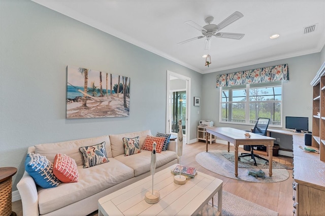 office space featuring ceiling fan, light hardwood / wood-style floors, and crown molding