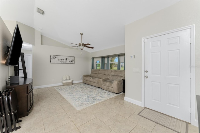 living room featuring light tile patterned floors, ceiling fan, and lofted ceiling