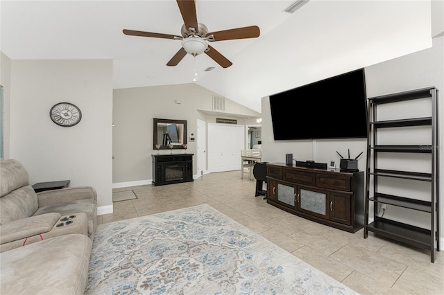 living room with ceiling fan, lofted ceiling, and light tile patterned flooring