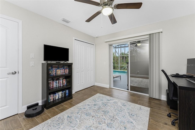 office area with dark hardwood / wood-style floors and ceiling fan