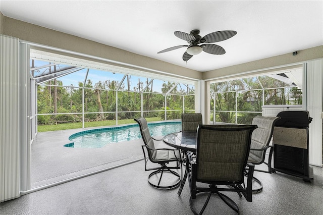 sunroom featuring a wealth of natural light and ceiling fan