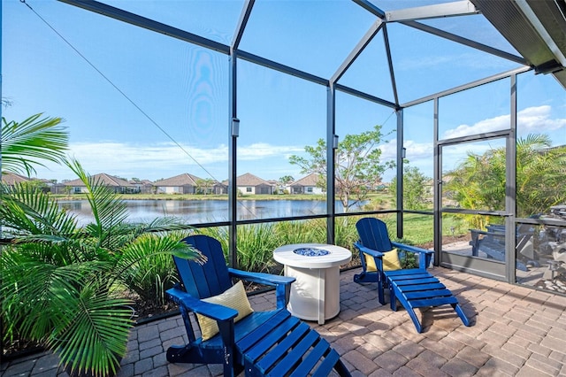 sunroom / solarium with a water view