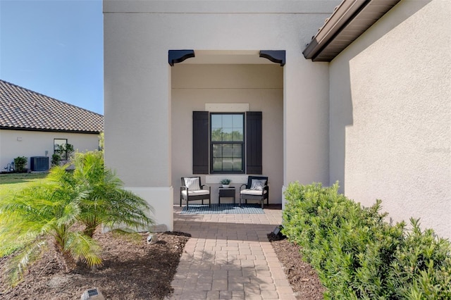 entrance to property featuring central AC