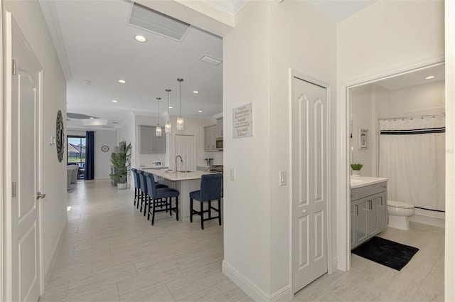 hallway featuring ornamental molding