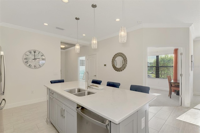 kitchen with dishwasher, sink, hanging light fixtures, crown molding, and an island with sink