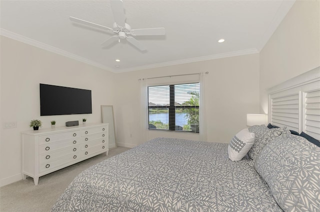 bedroom featuring ceiling fan, ornamental molding, and light carpet