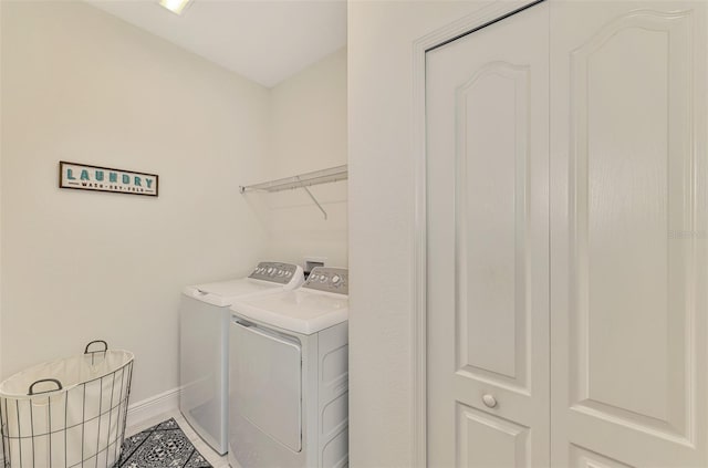 clothes washing area featuring independent washer and dryer