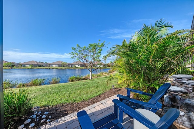 view of patio with a water view