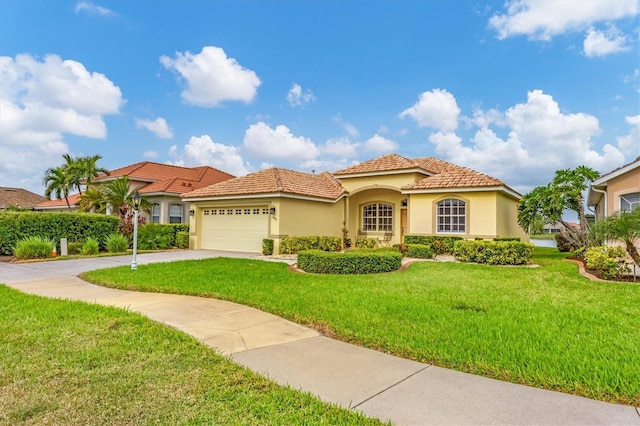 mediterranean / spanish house featuring a front lawn and a garage