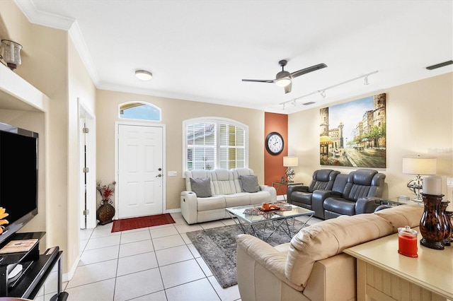 living room featuring light tile patterned floors, rail lighting, ceiling fan, and crown molding