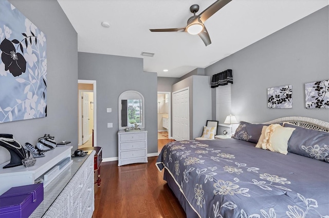 bedroom with ceiling fan, dark hardwood / wood-style floors, ensuite bathroom, and a closet